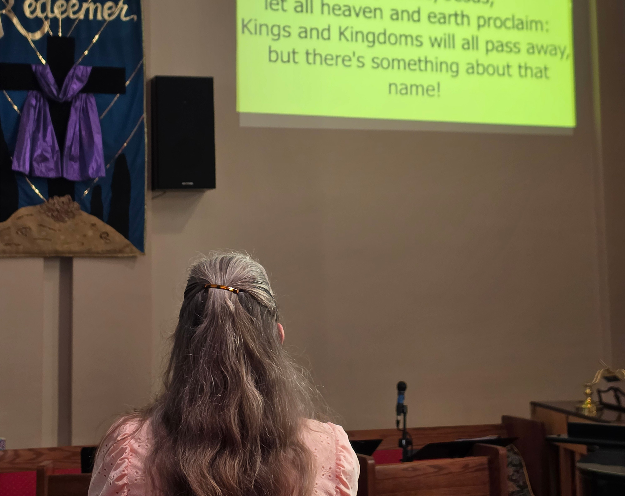 Woman praying at Havre First Presbyterian Church